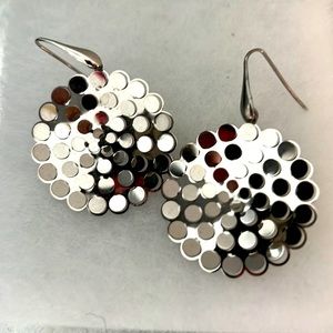 Handmade silver color earrings by a French designer